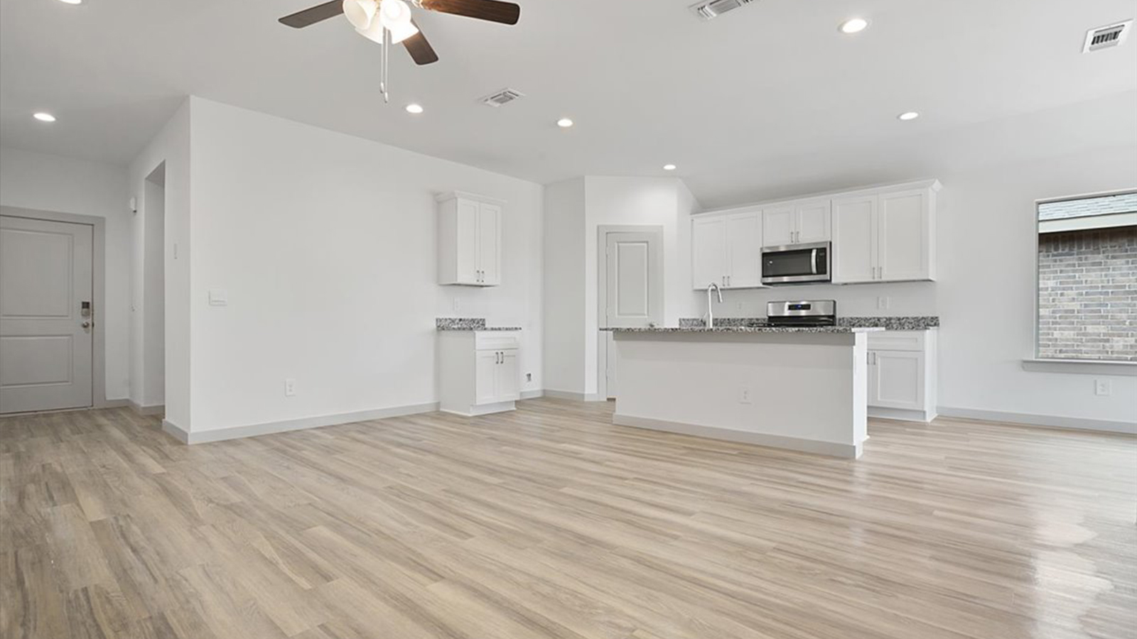 Open concept kitchen, living, family, and dining room space