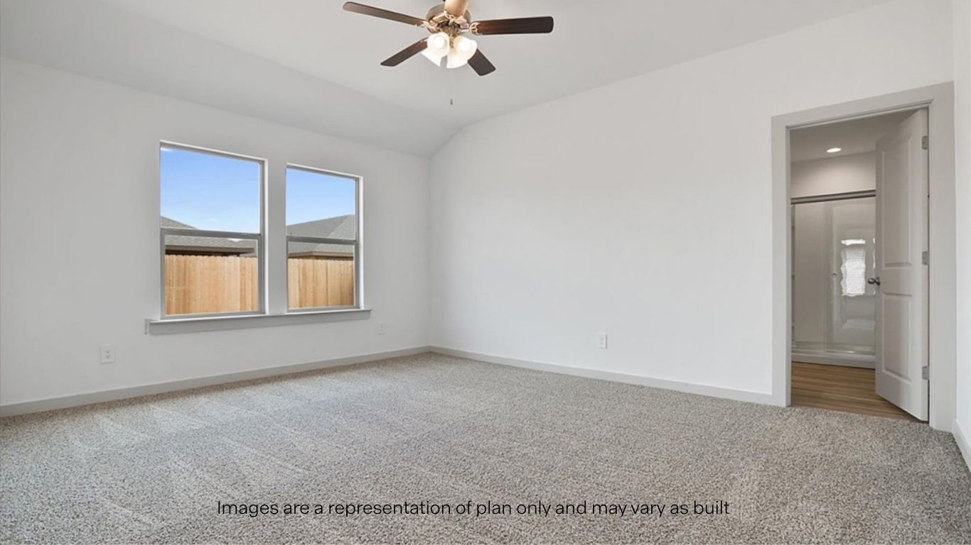Primary bedroom with plush carpet floors and light allowing double windows