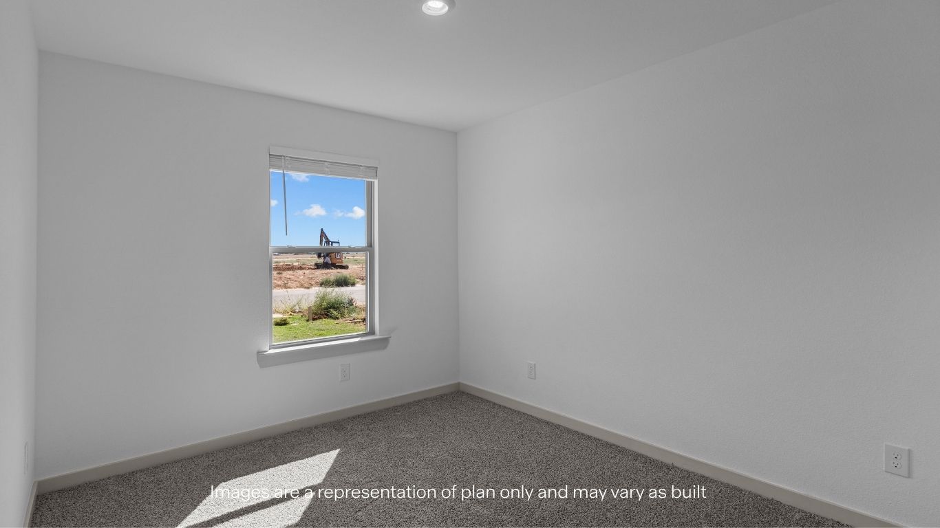 Guest bedroom with front window and ample lighting