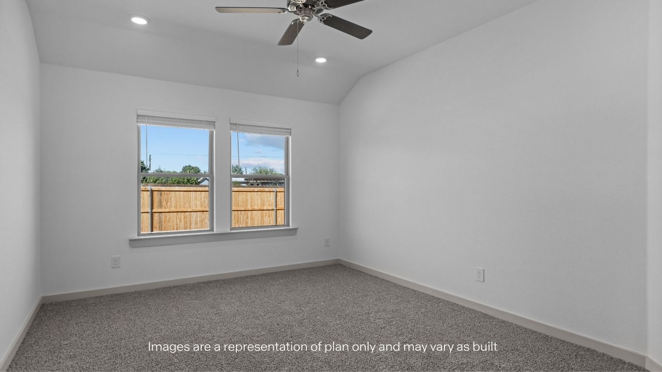 Primary bedroom with plush carpet floors and light allowing double windows