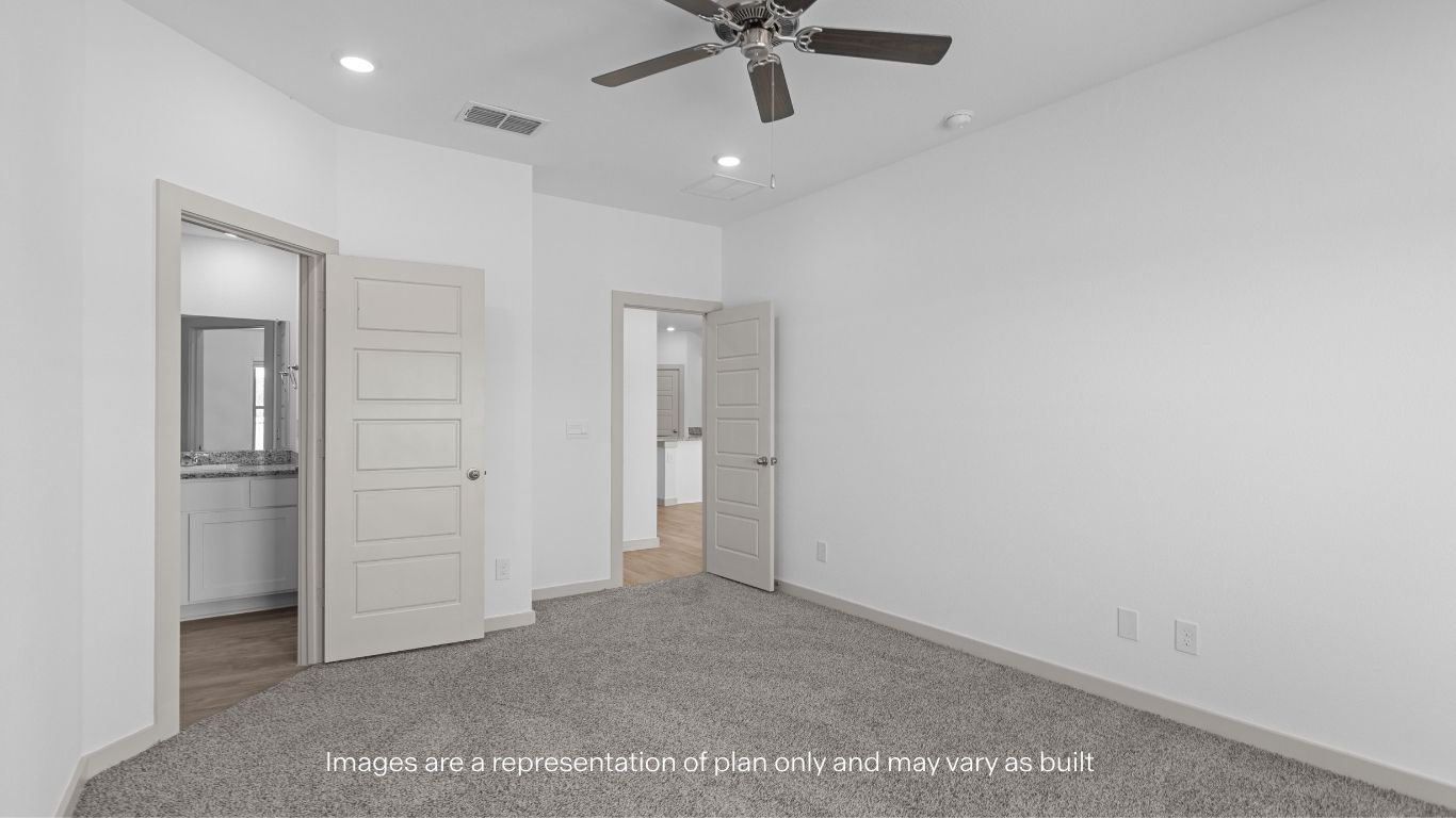 Primary bedroom with private attached bathroom and walk-in closet