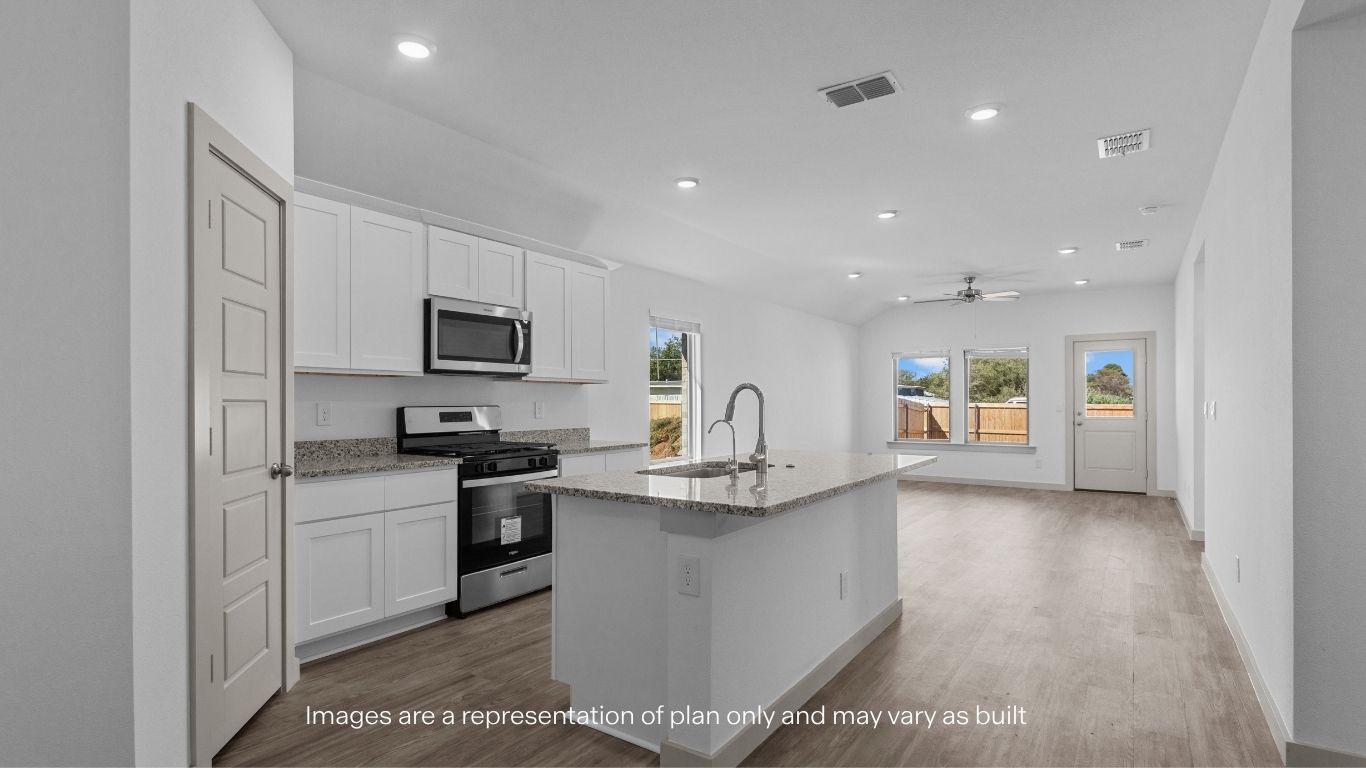 Spacious open concept kitchen with island and counter prep space