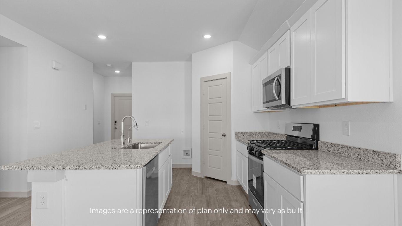 Open concept kitchen with stainless steel appliances, shaker style cabinets, and elevated finishes