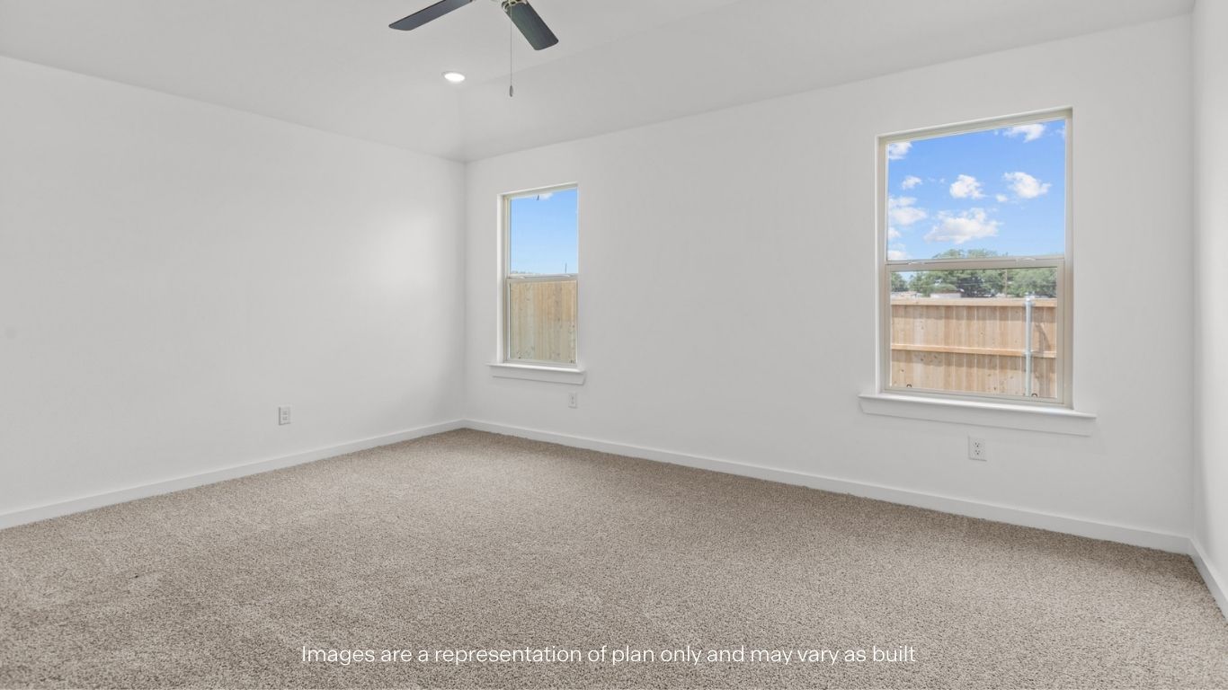 Primary bedroom with plush carpet floors and light allowing double windows