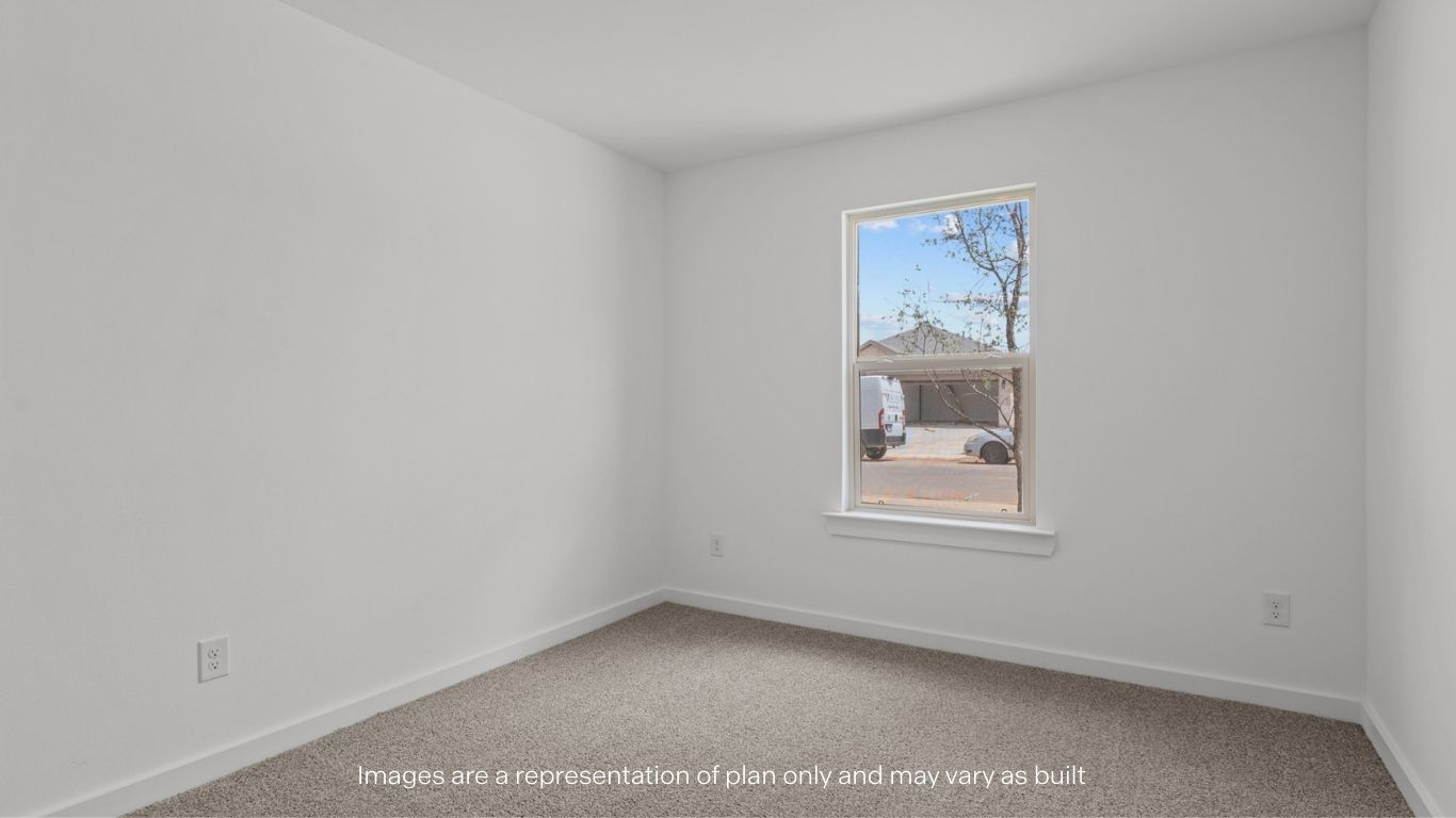 Guest bedroom 1 with front windows and ample natural light