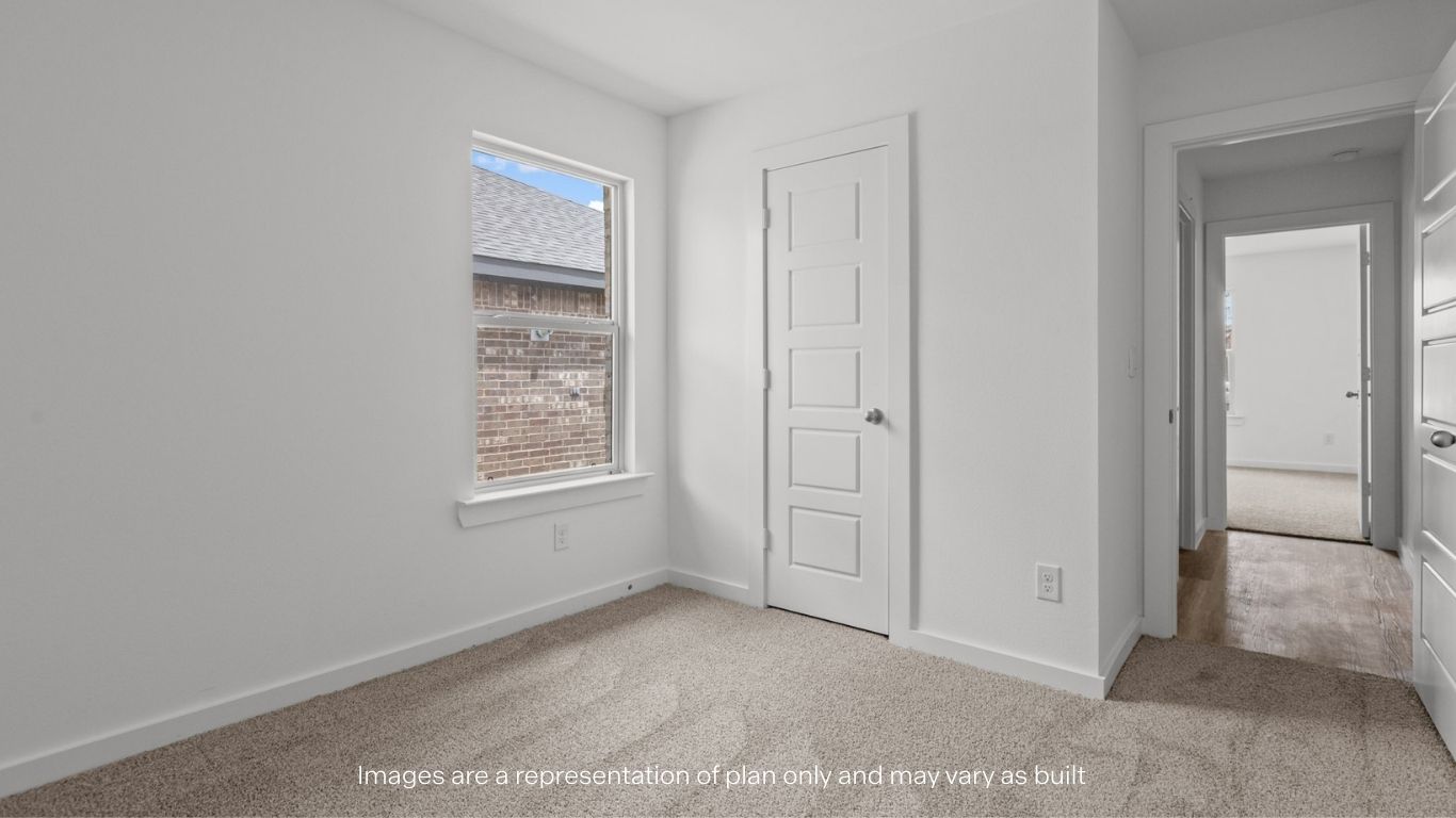Guest bedroom 2 with side window and plush carpet floor