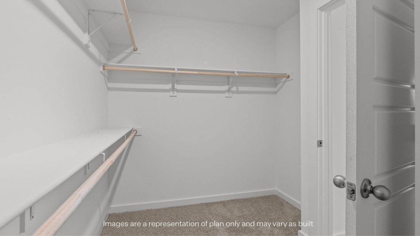 Primary walk-in closet with extra storage space