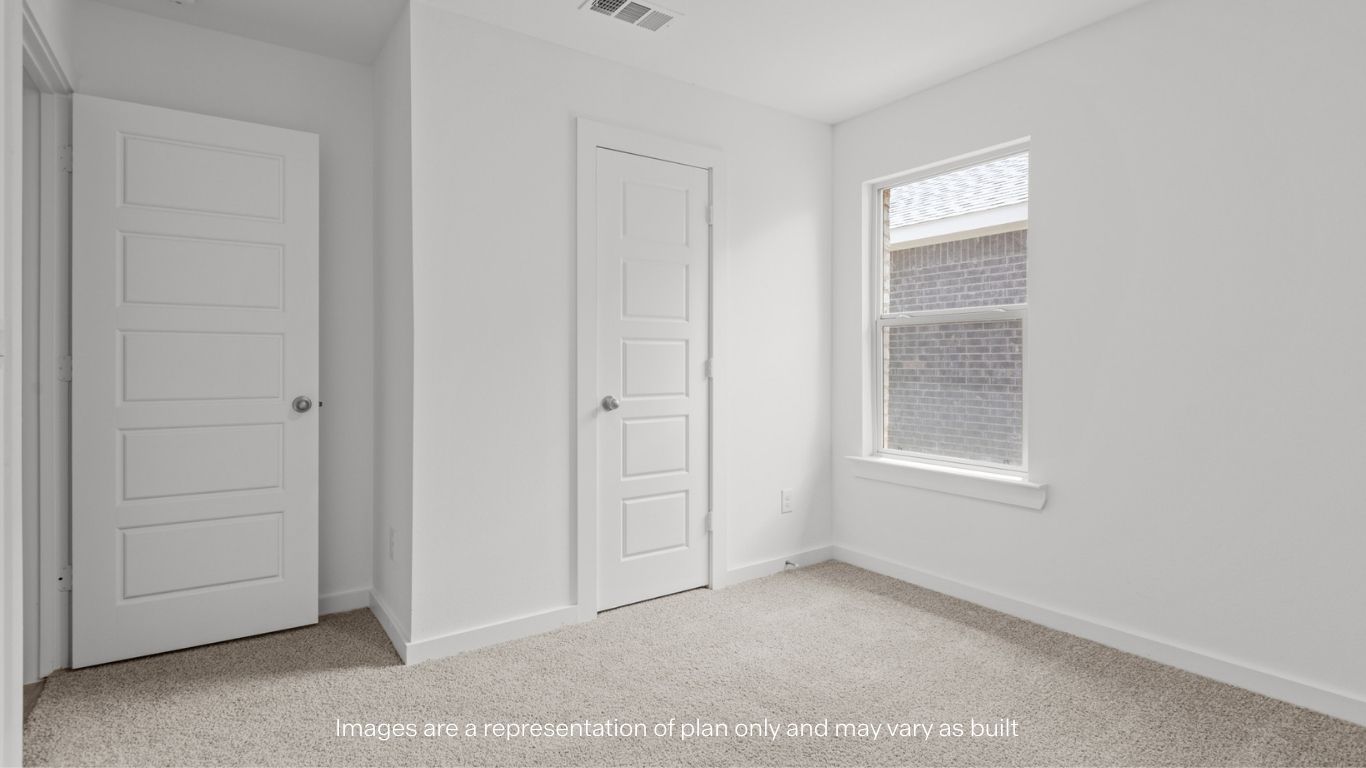 Guest bedroom 3 with plush carpet floors and spacious closet