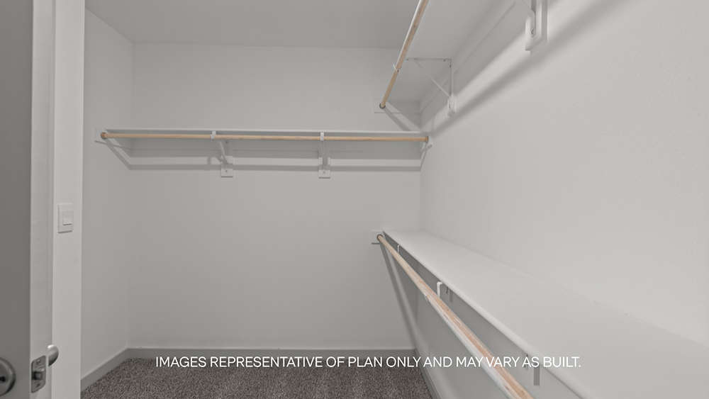 Primary walk-in closet with extra storage space