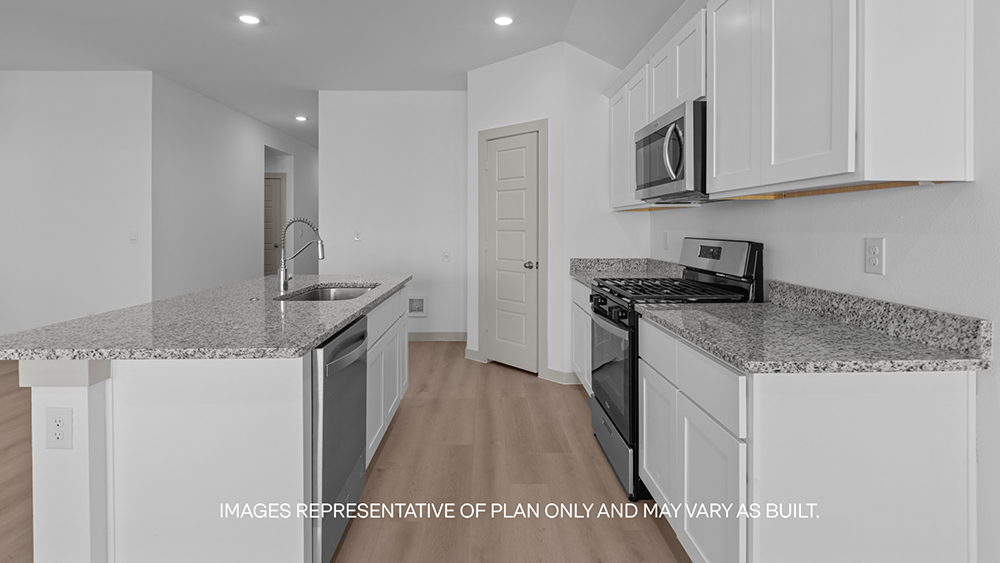 Spacious open concept kitchen with island and counter prep space
