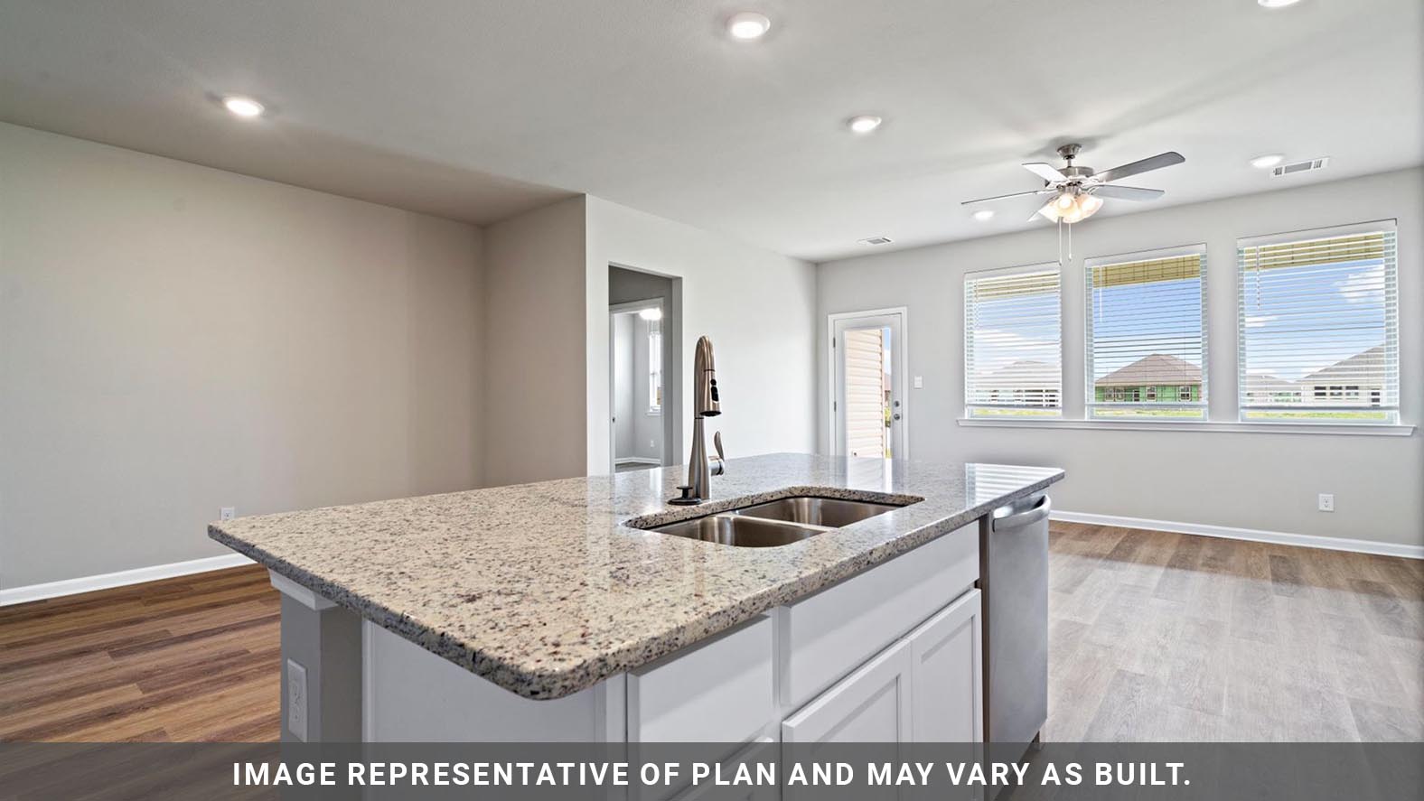 Open concept kitchen with stainless steel appliances, shaker style cabinets, and elevated finishes