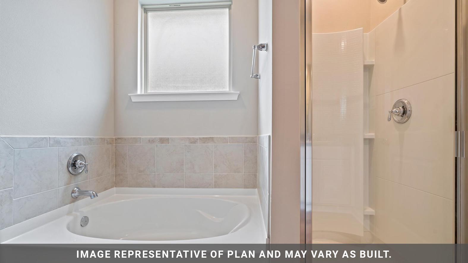 Primary bathroom with built in vanity and luxurious shower