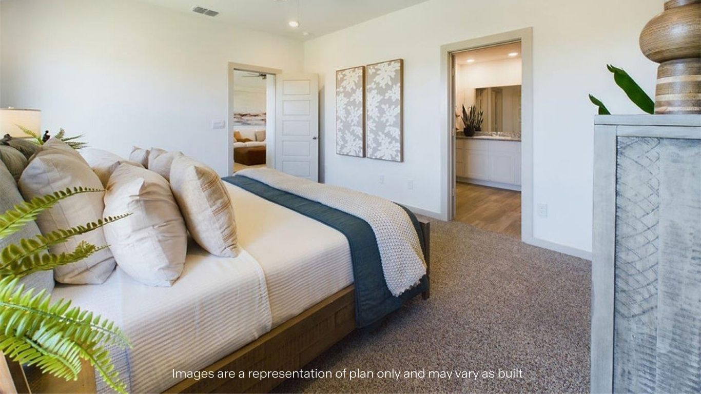 Primary bedroom with plush carpet floors and light allowing double windows