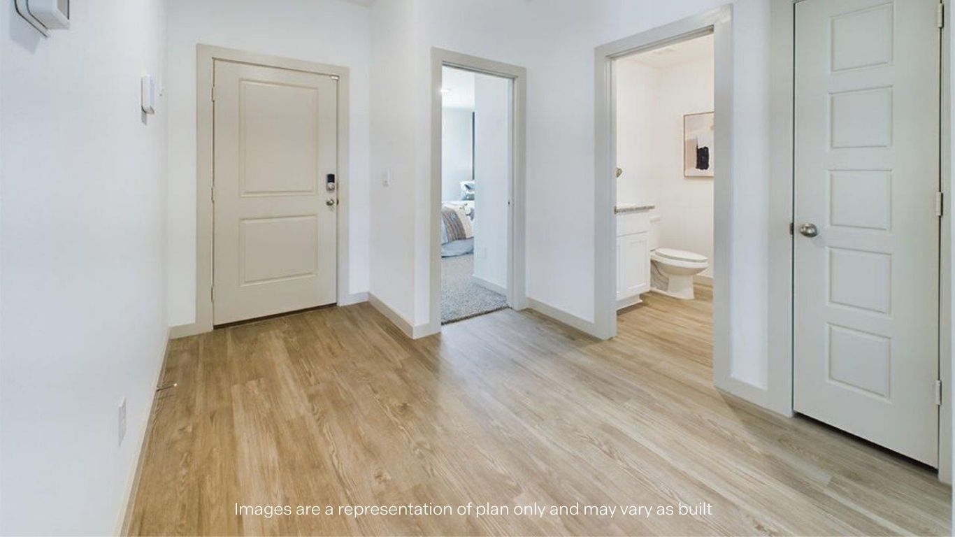 Spacious entry foyer leading to bedrooms and kitchen area