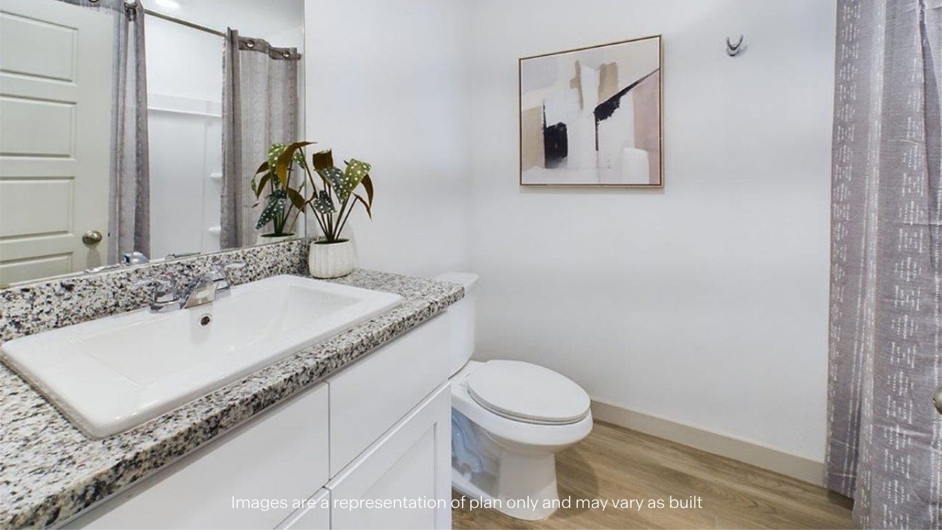 Guest bathroom with built in vanity and combination bathtub shower
