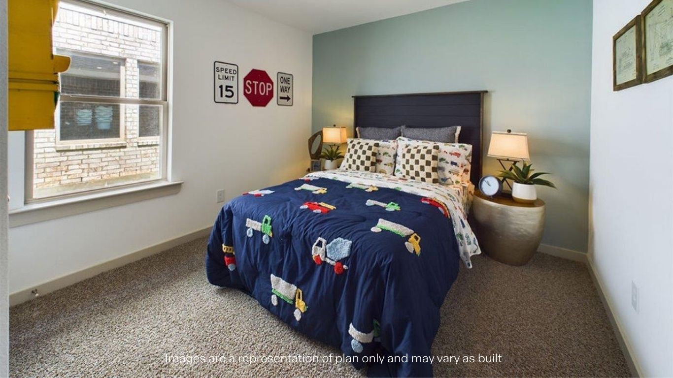 Guest bedroom 2 with side window and plush carpet floor