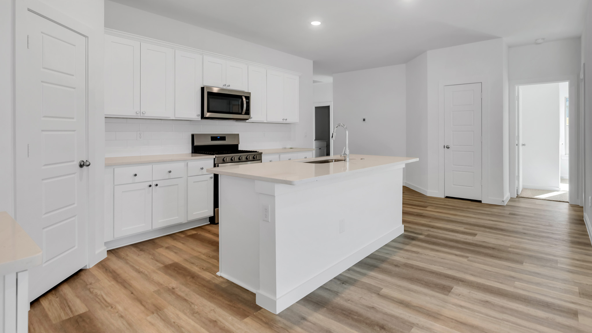 Open concept kitchen with ample lighting
