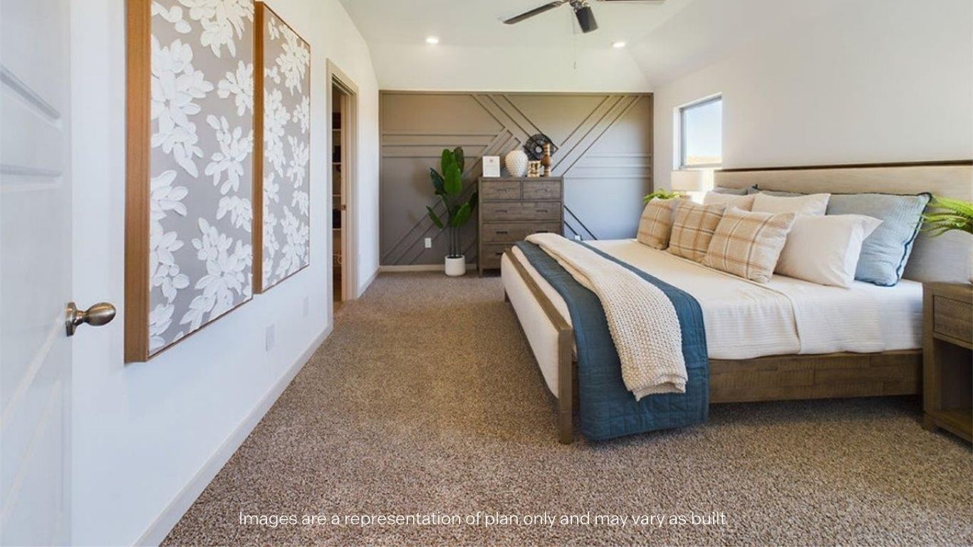 Primary bedroom with plush carpet floors and light allowing double windows