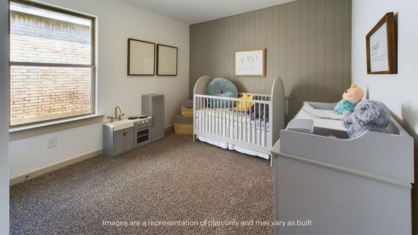 Guest bedroom with side window and plush carpet floors
