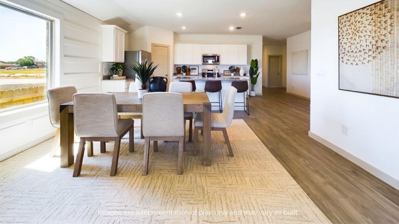 Open concept dinning and kitchen area with wood floors