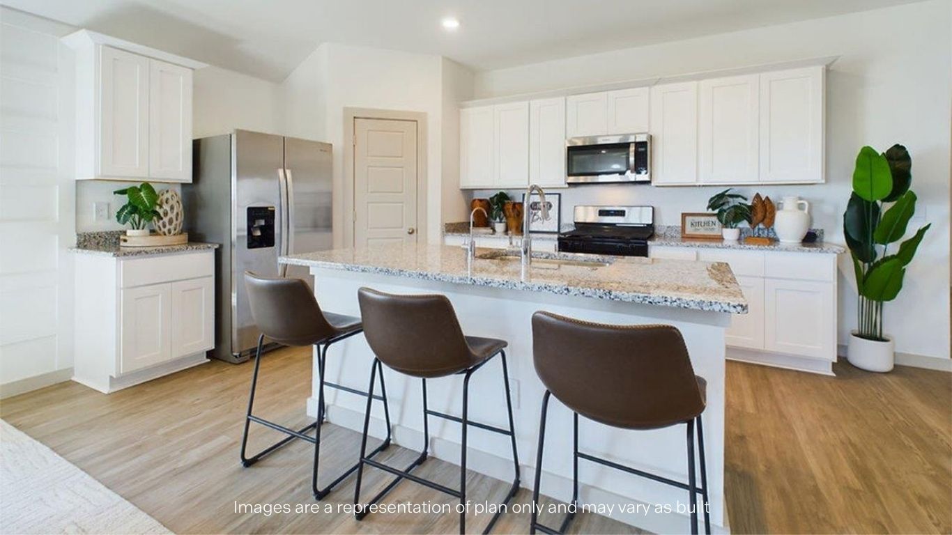 open concept kitchen with island and large pantry