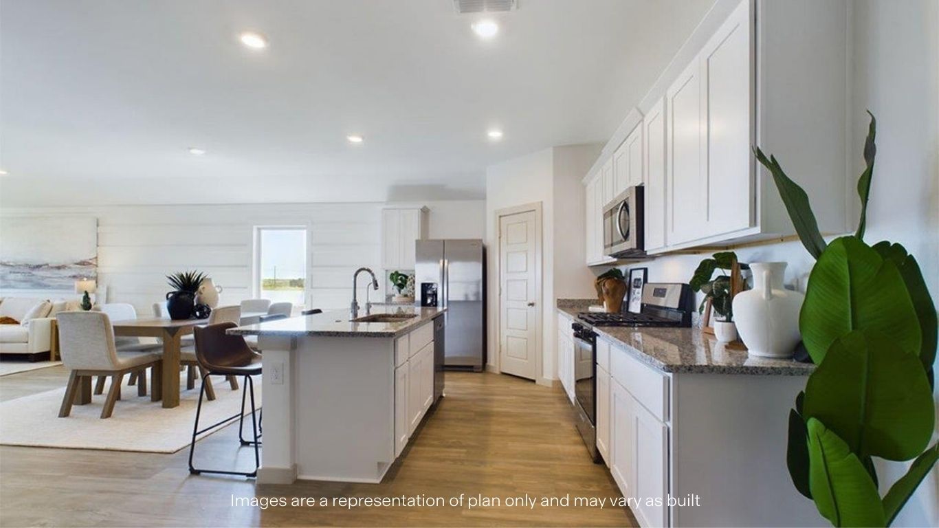 open concept kitchen with island and large pantry