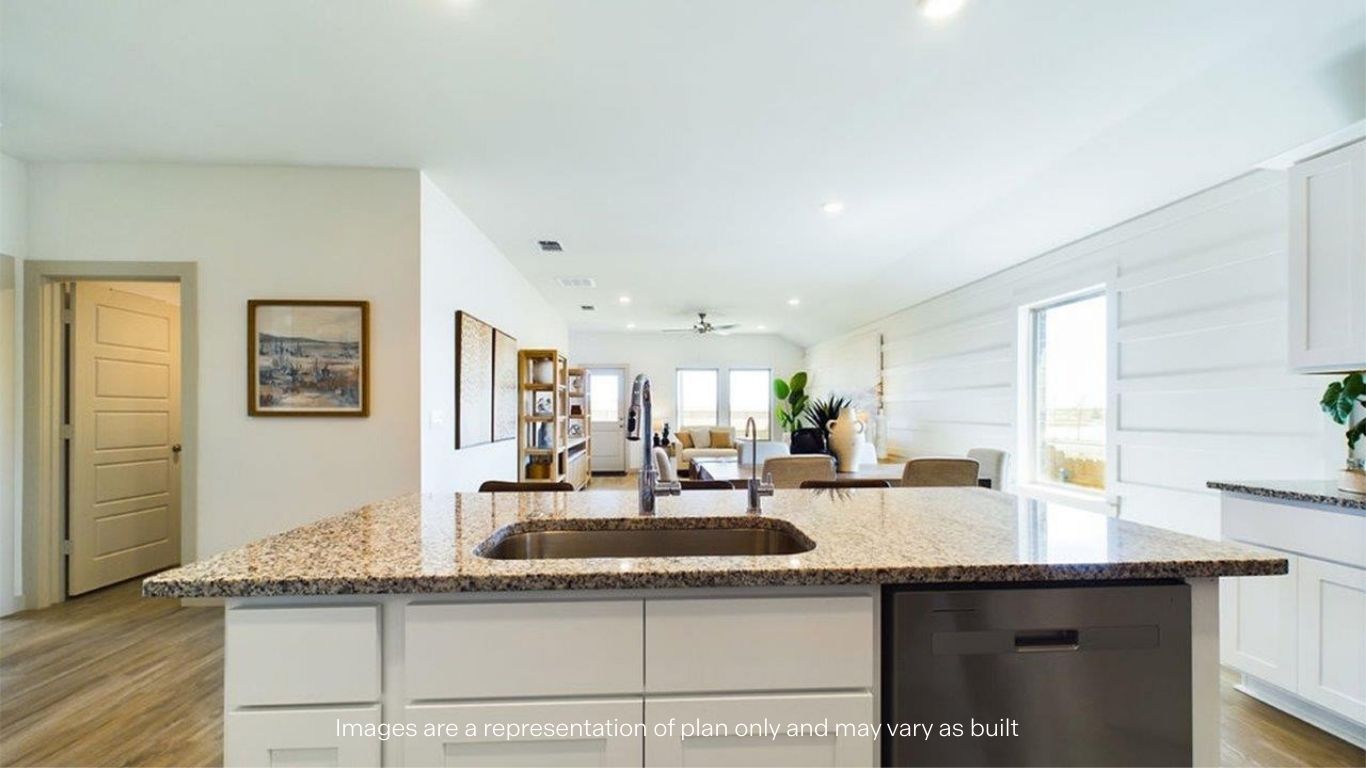open concept kitchen with island and large pantry