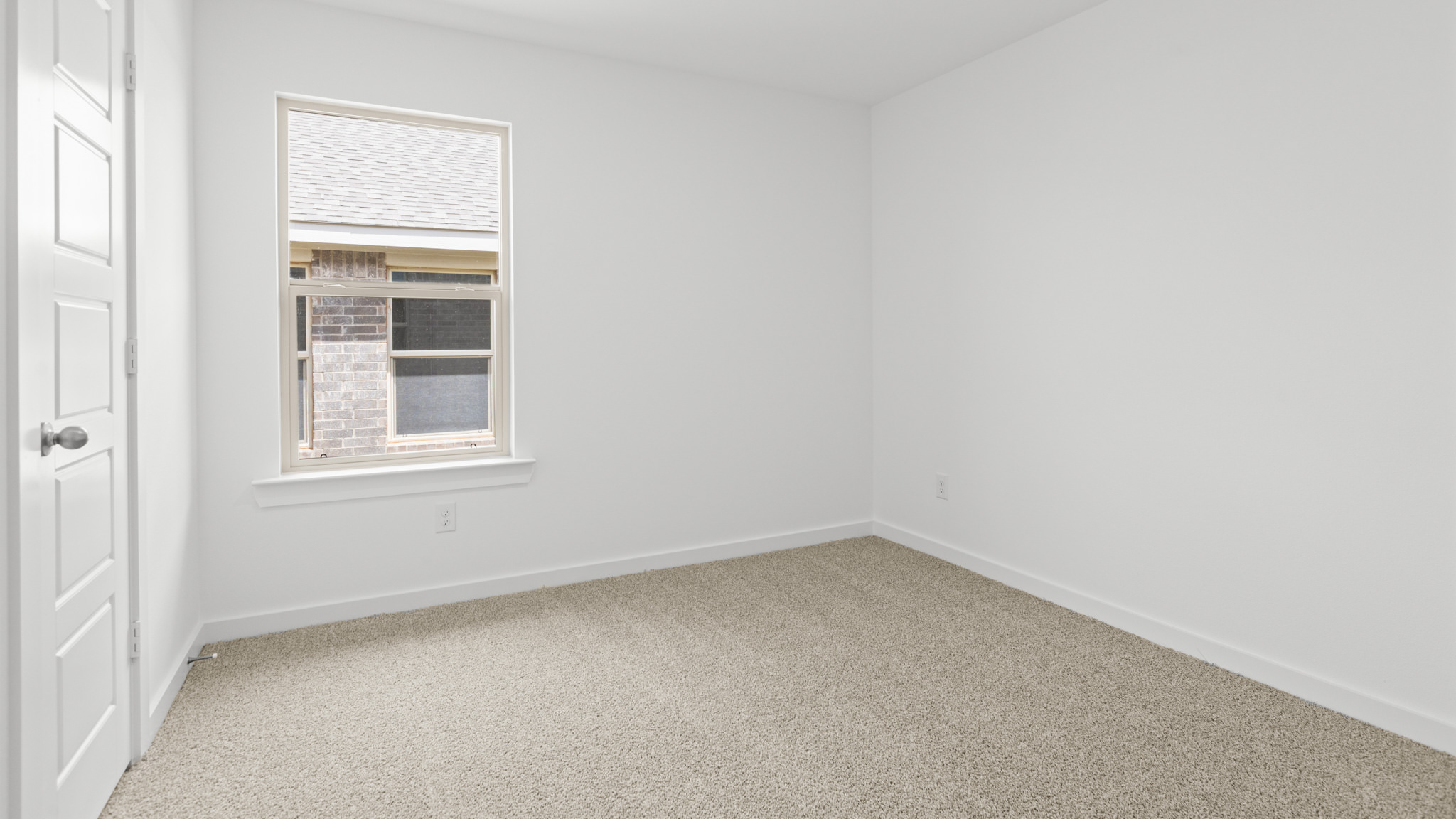 guest bedroom with plush carpet and spacious closet
