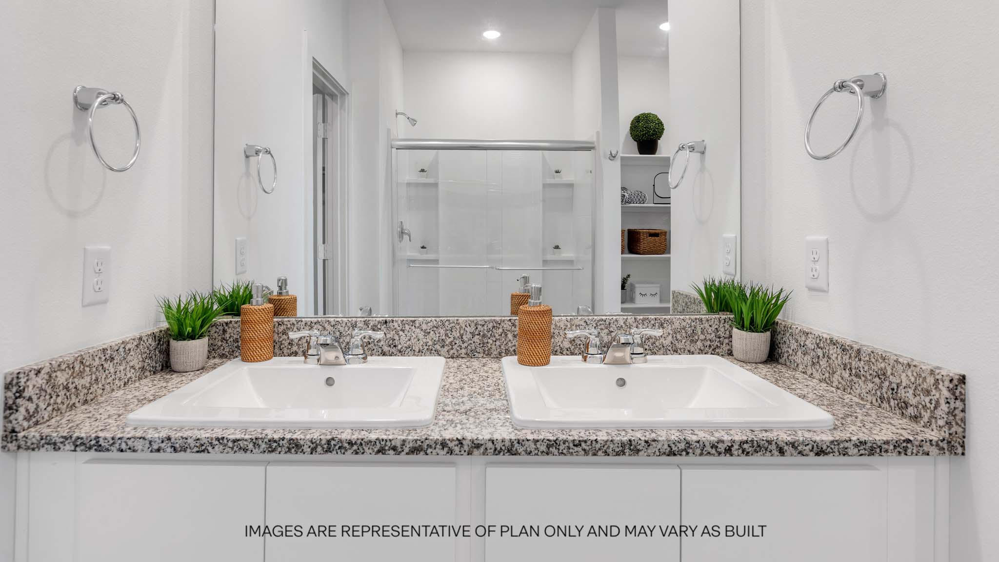 Private attached primary bathroom with built in vanity and luxurious shower