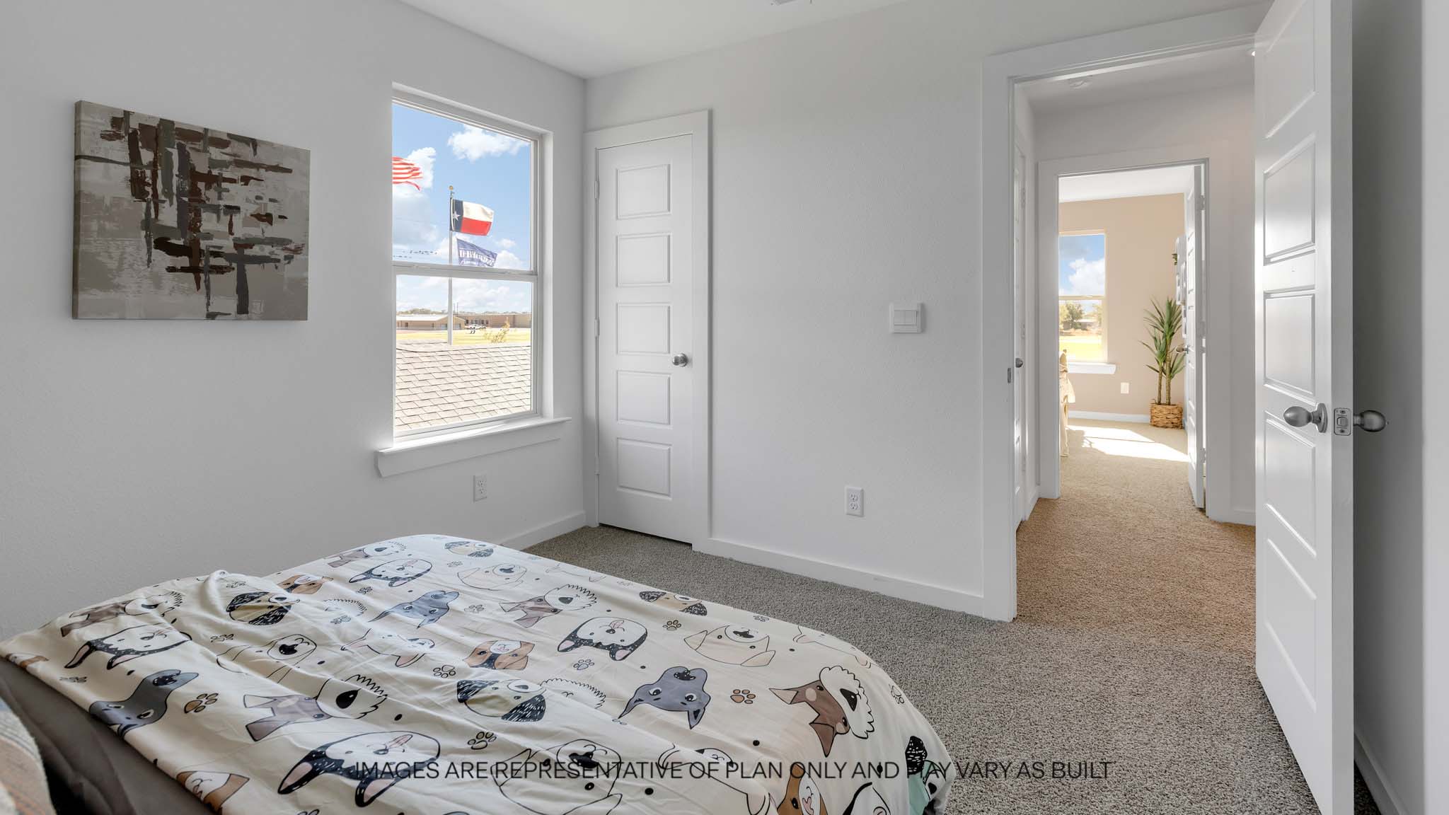Upstairs guest bedroom with plush carpet floors and spacious closet