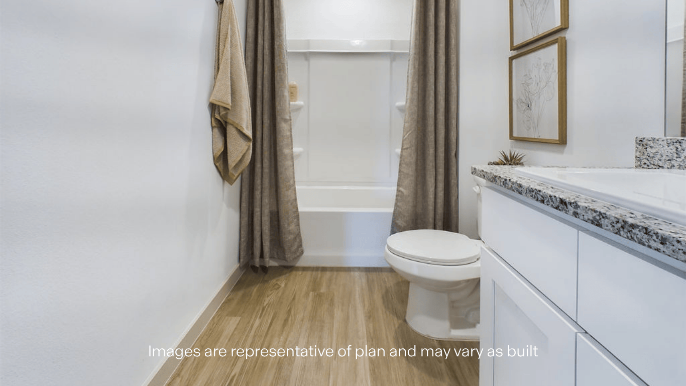 Upstairs guest bathroom with built in vanity and combination bathtub shower