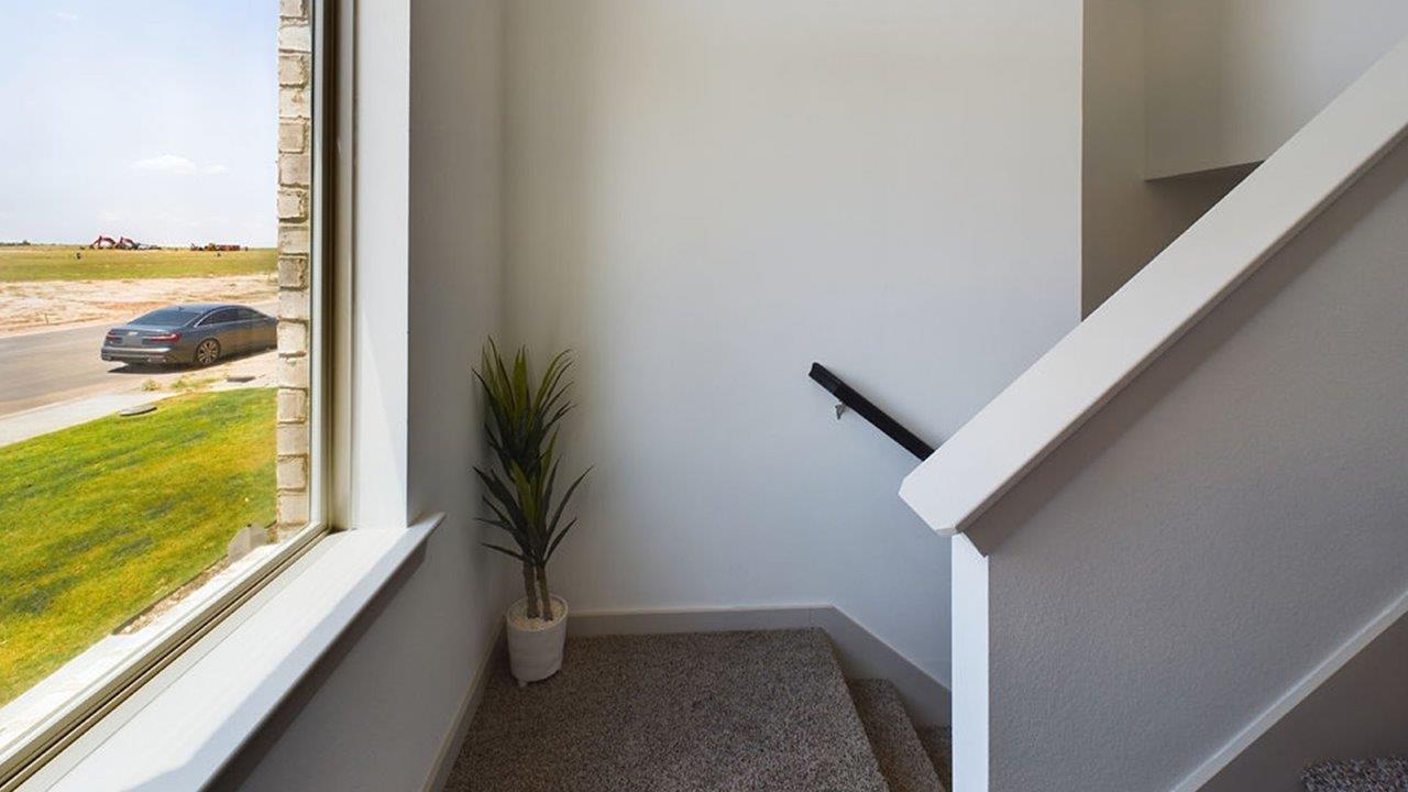stairs landing with window view
