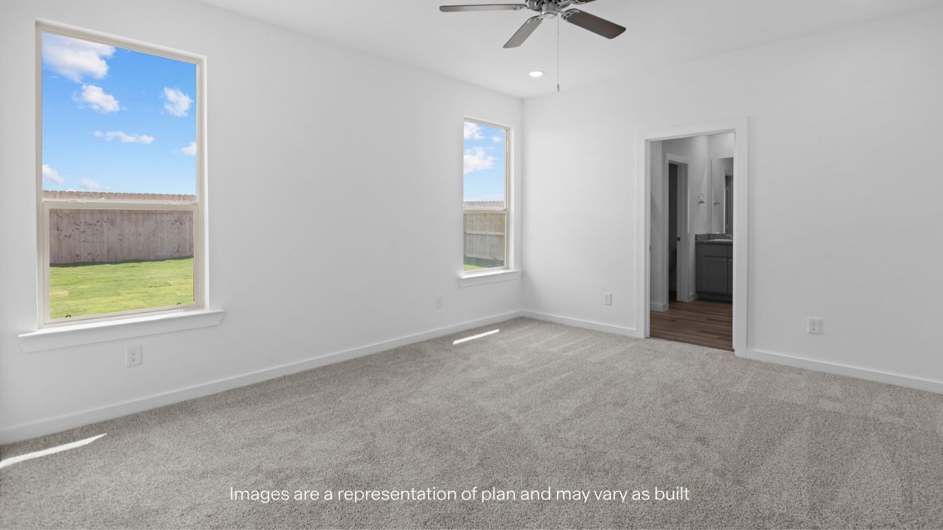 Primary bedroom with plush carpet floors and light allowing double windows