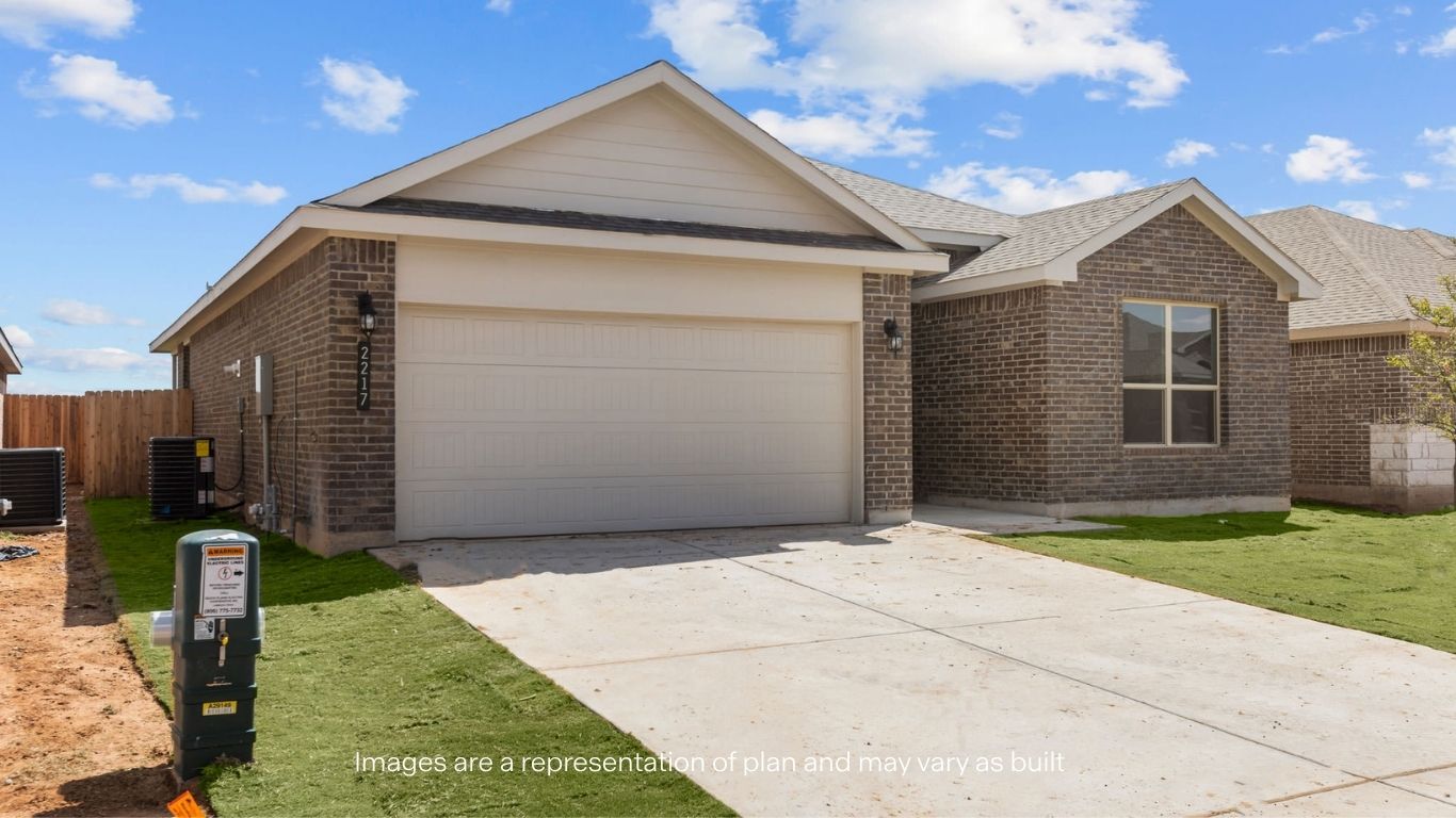 Side view of single story timeless brick home