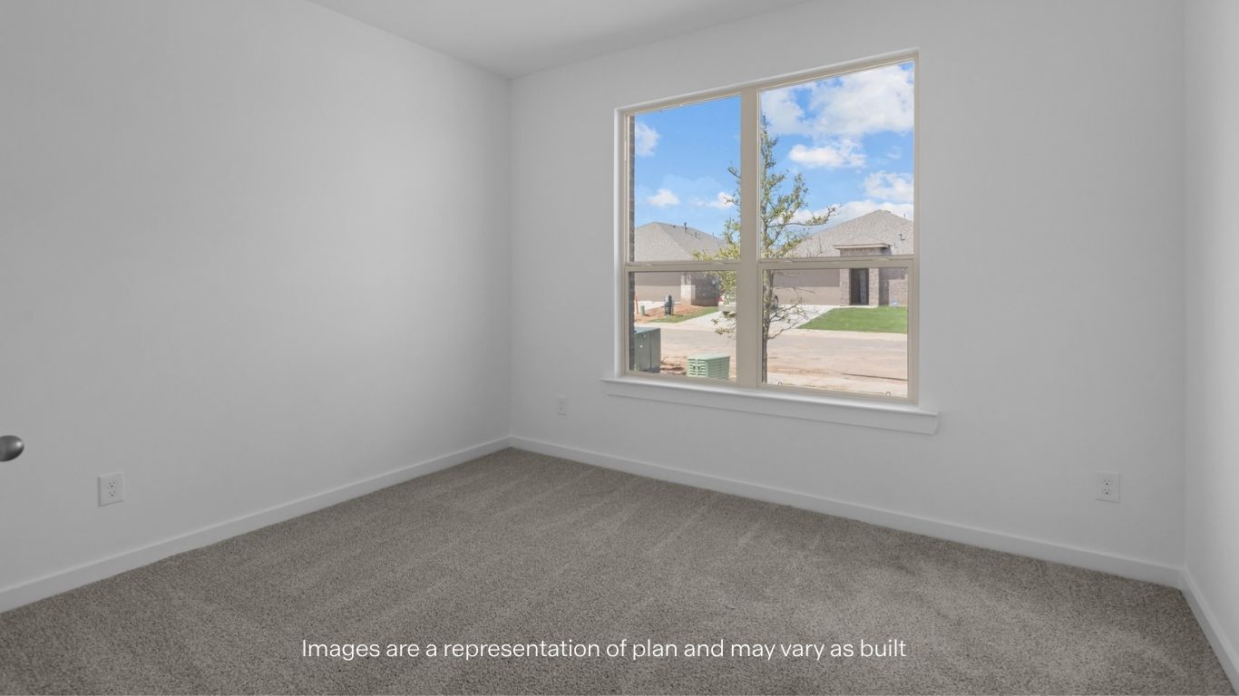 Guest bedroom 1 with front windows and ample natural light