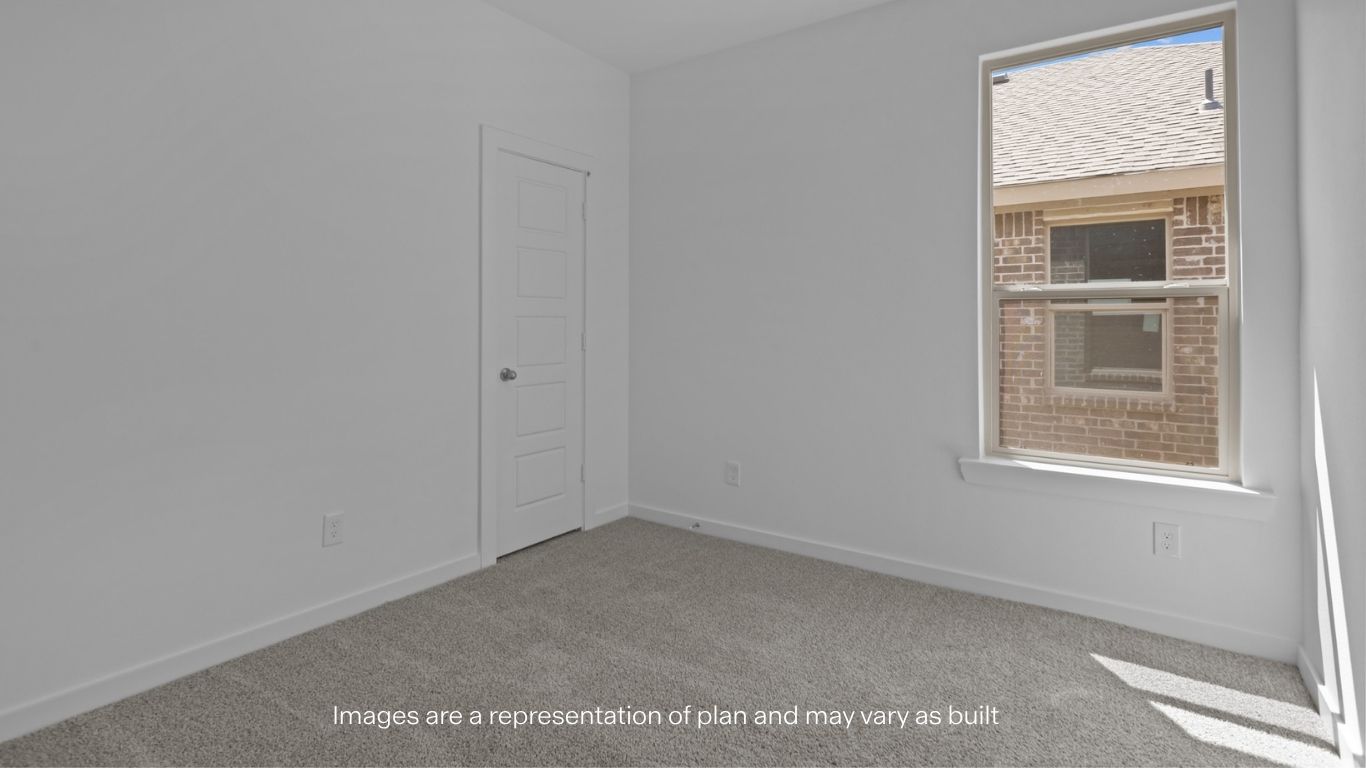 Guest bedroom 2 with side window and plush carpet floor