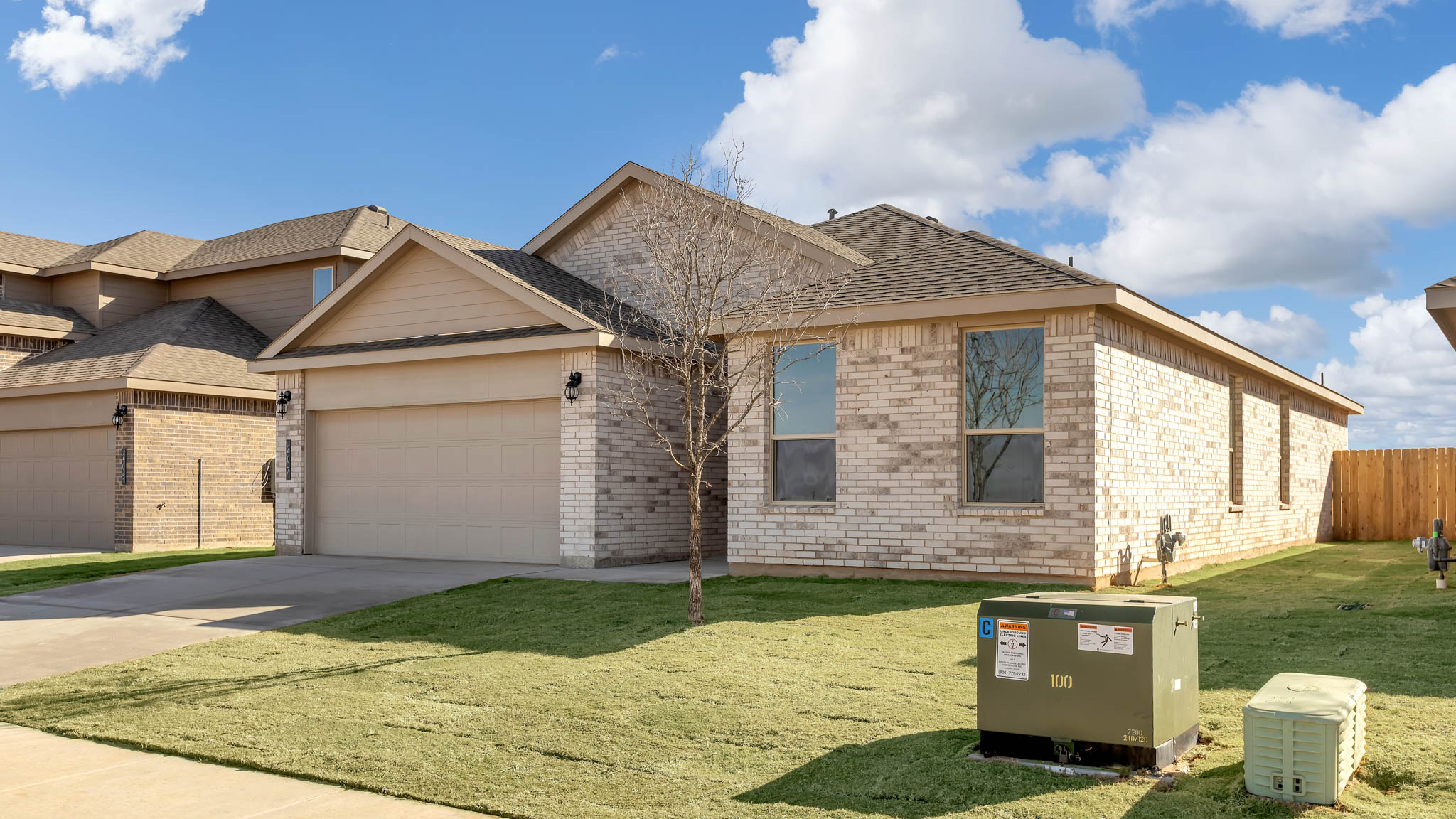 Side view of single story timeless brick home