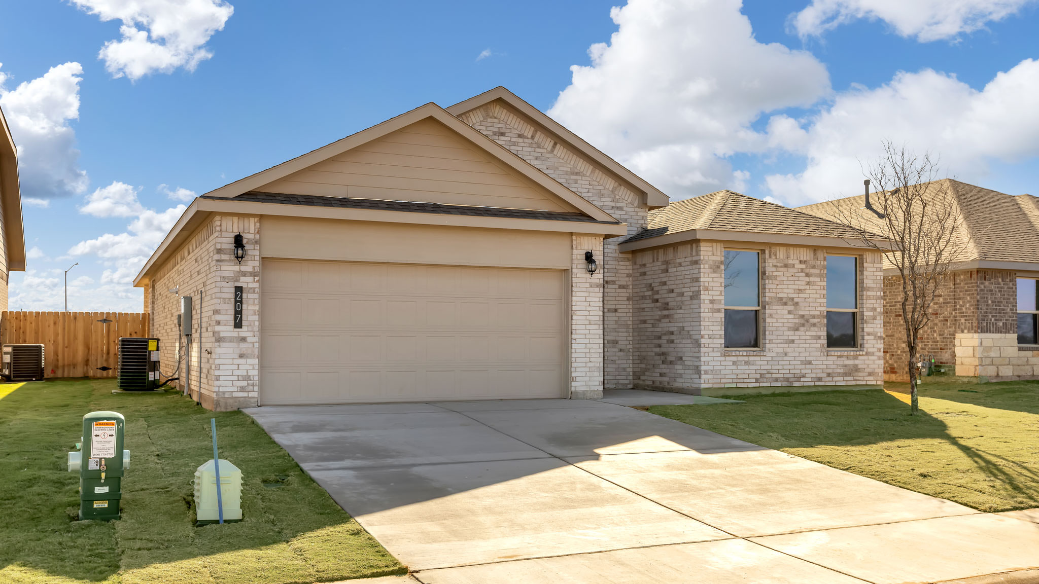 Side view of single story timeless brick home