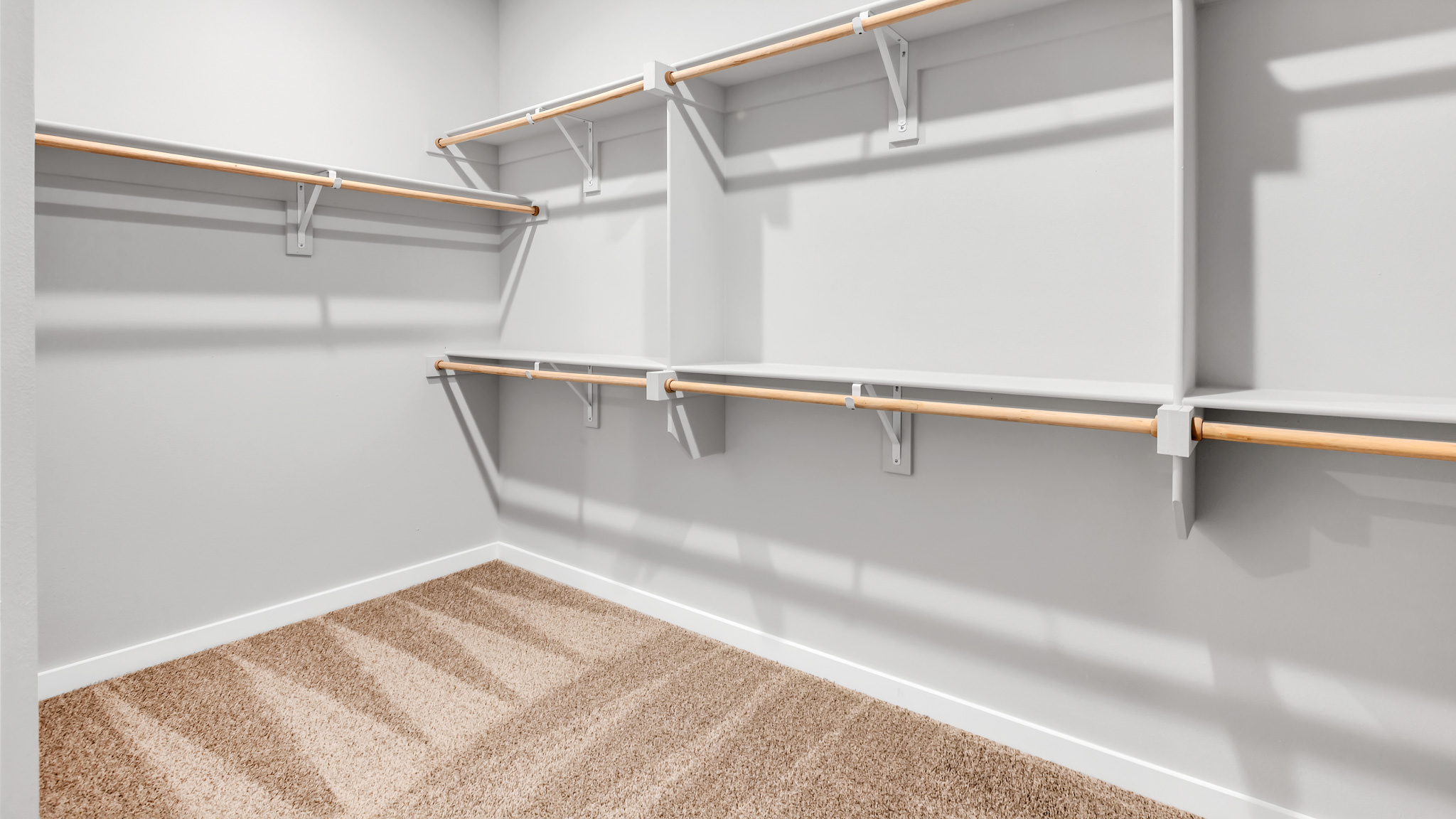Primary room walk in closet with extra storage space