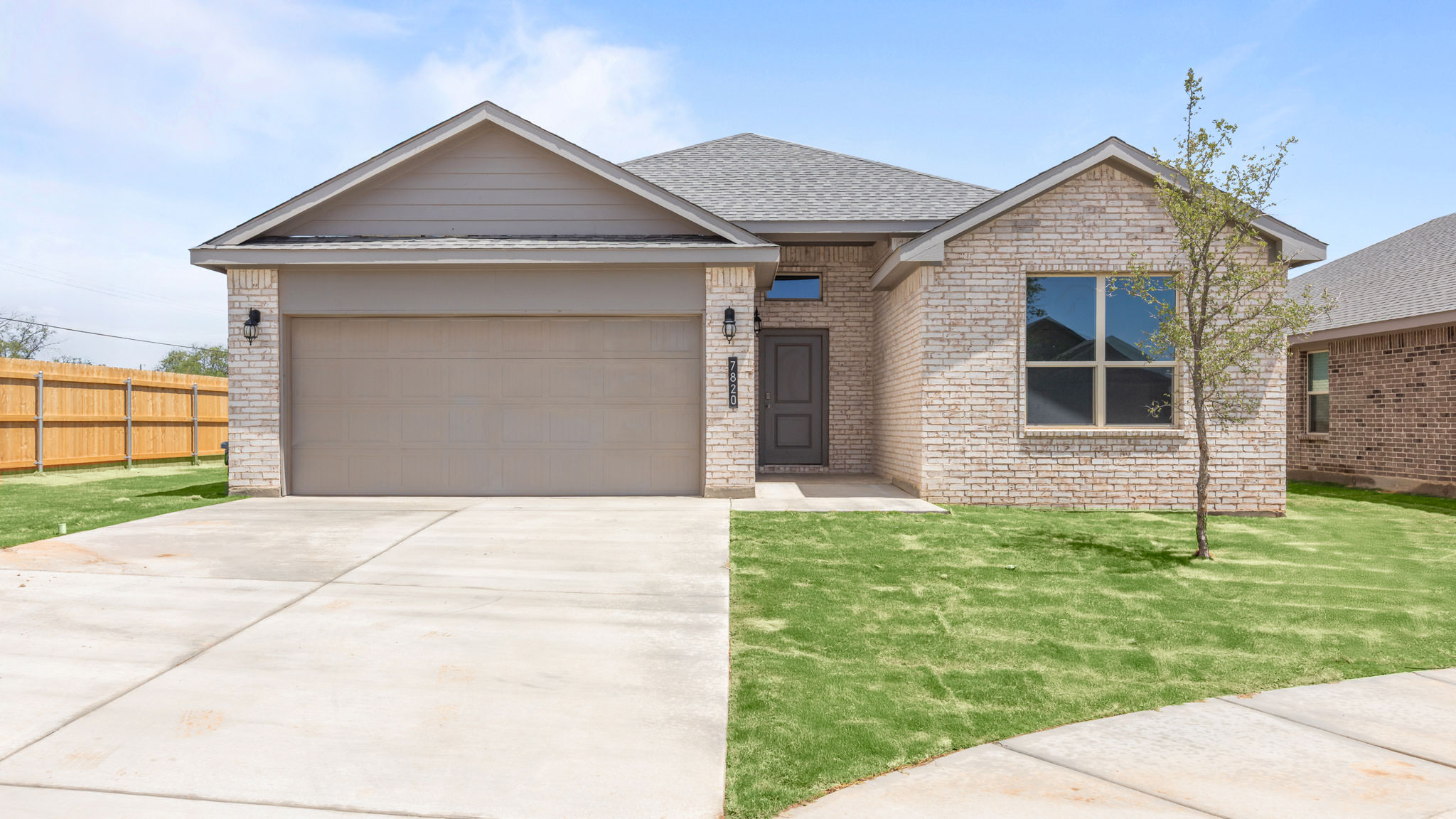 Exterior of single story modern brick style home