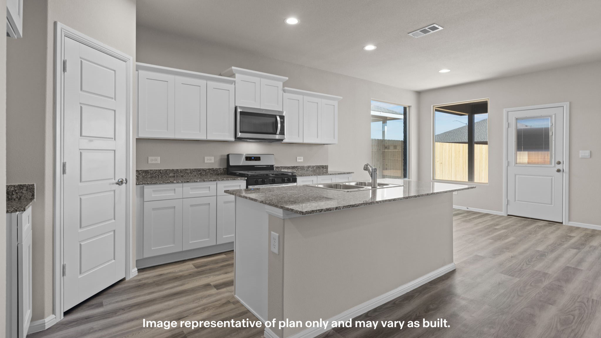 Spacious open concept kitchen with island and counter prep space