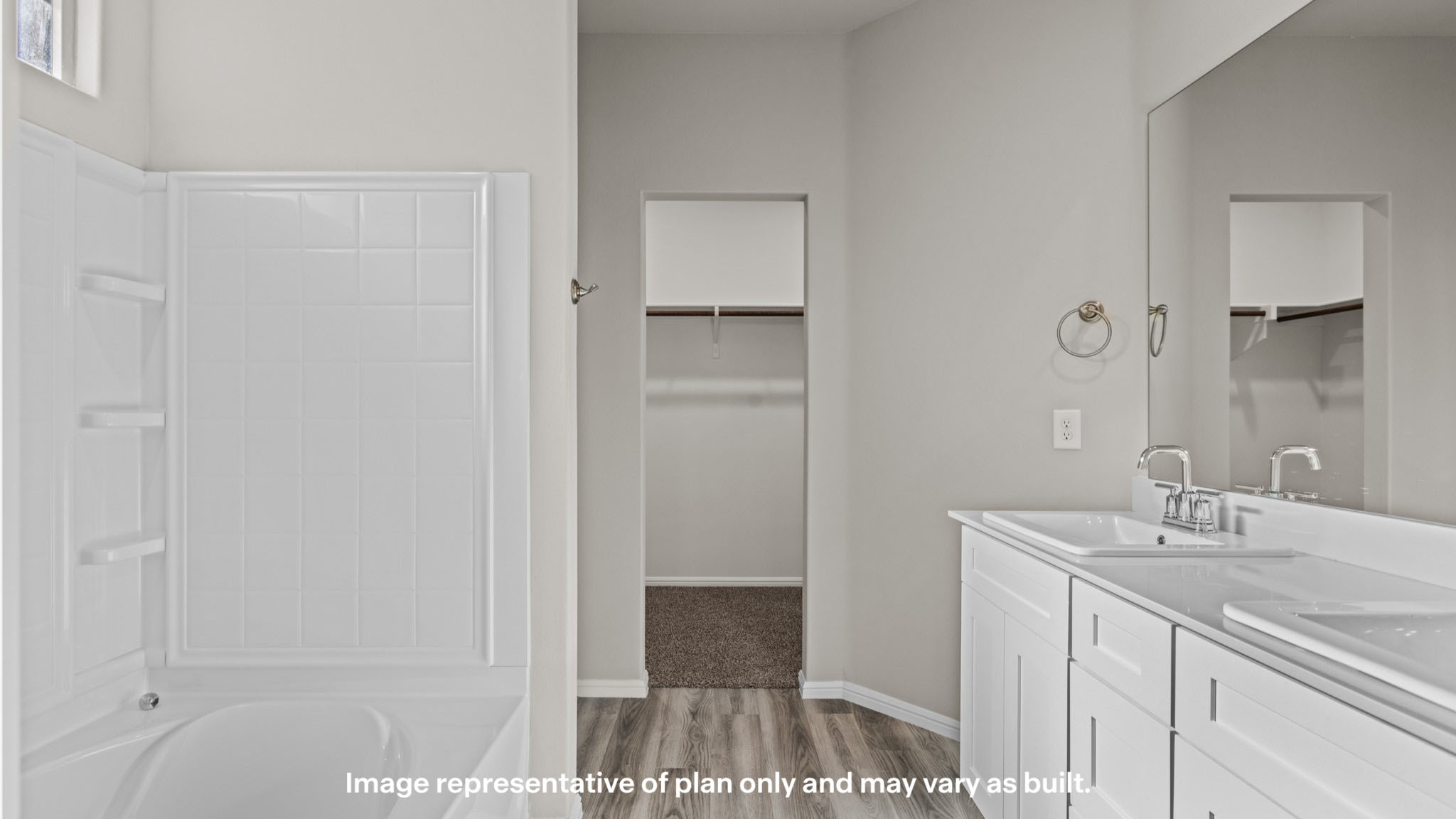 Private attached primary bathroom with built in vanity and luxurious shower