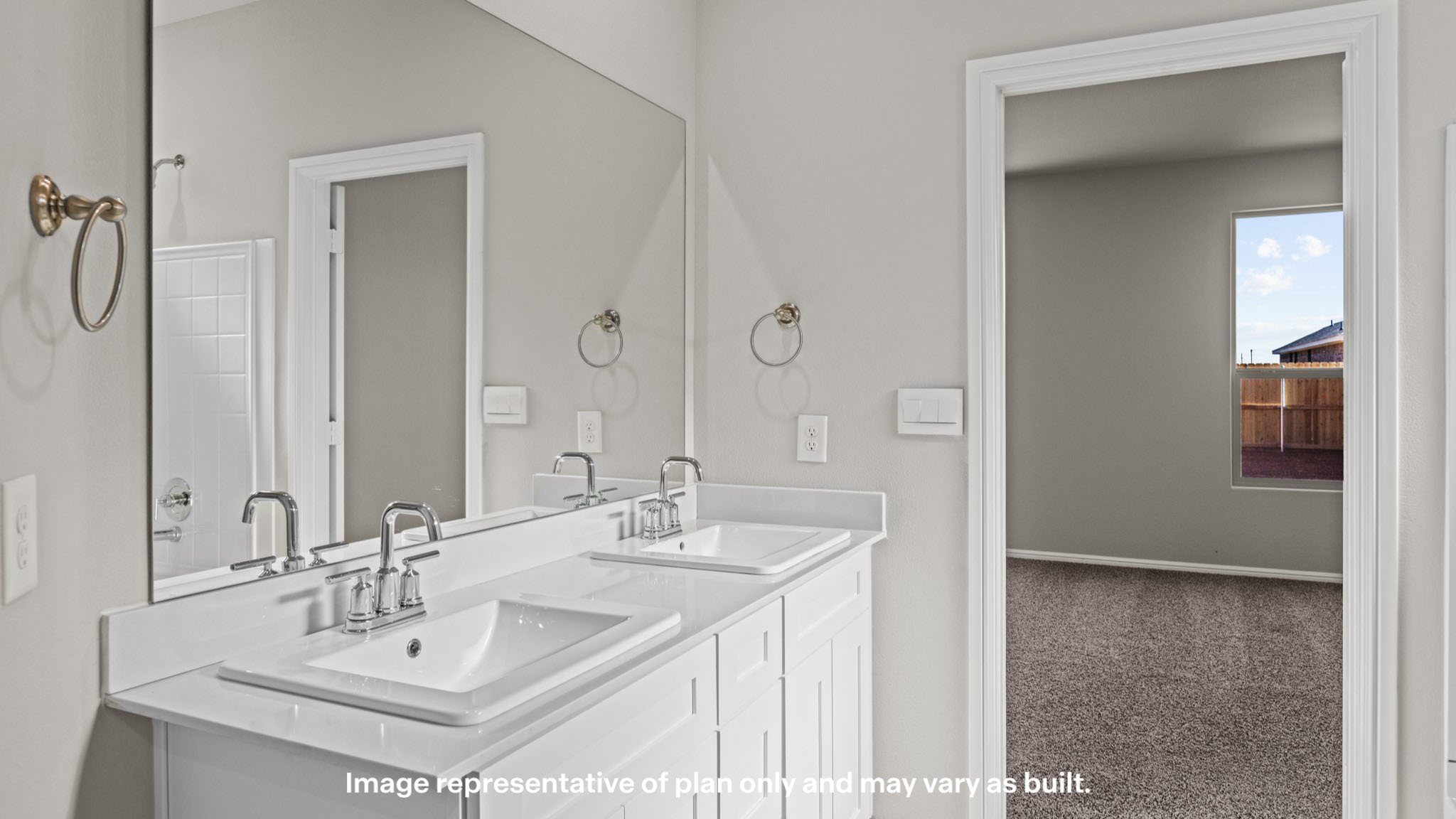 Private attached primary bathroom with built in vanity and luxurious shower