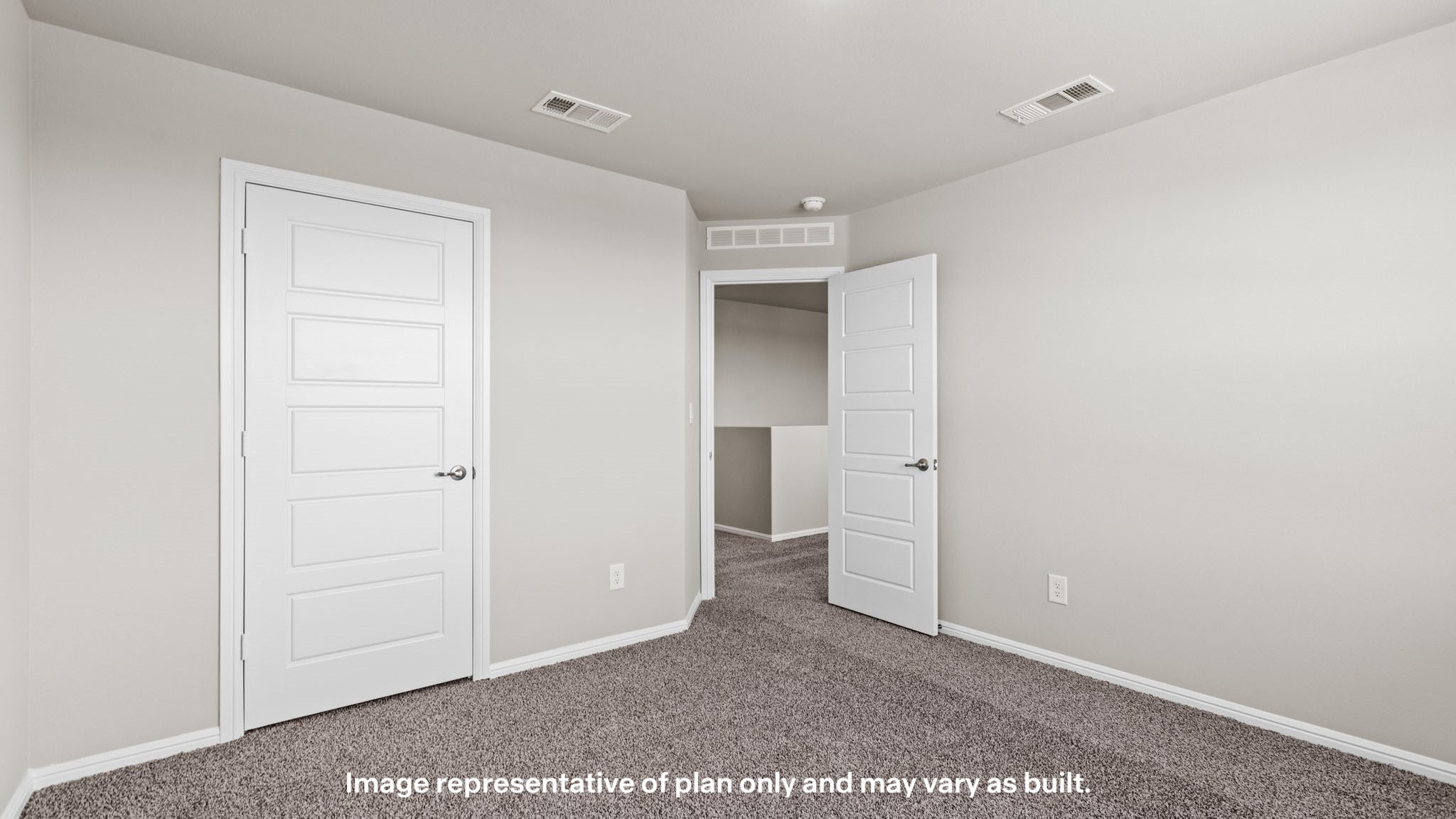 Upstairs guest bedroom with plush carpet floors and spacious closet