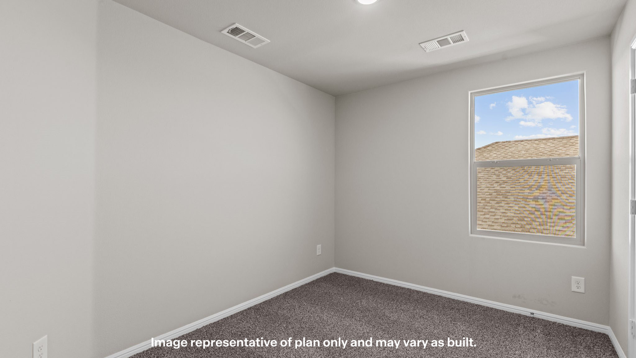 Guest bedroom with side window and plush carpet floors
