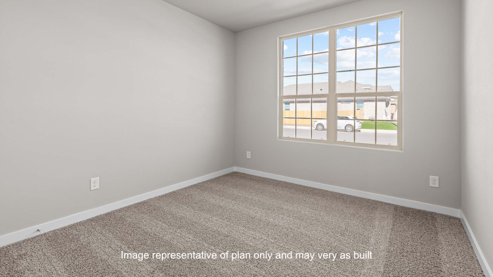 Guest bedroom 1 with front windows and ample natural light