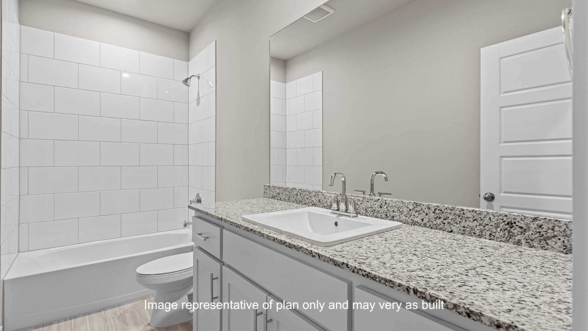 Guest bathroom with built in vanity and combination bathtub shower