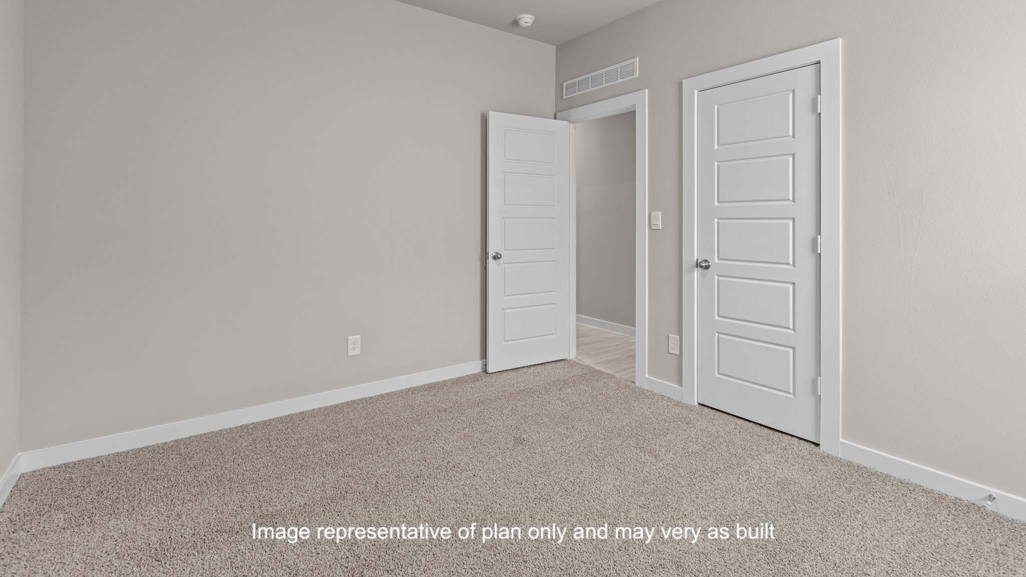 Guest bedroom 3 with plush carpet floors and spacious closet