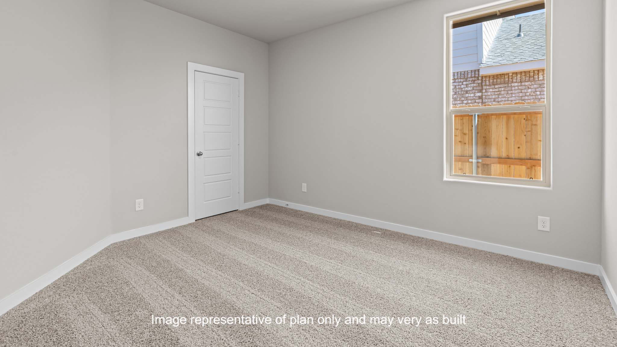 Guest bedroom with side window and plush carpet floor