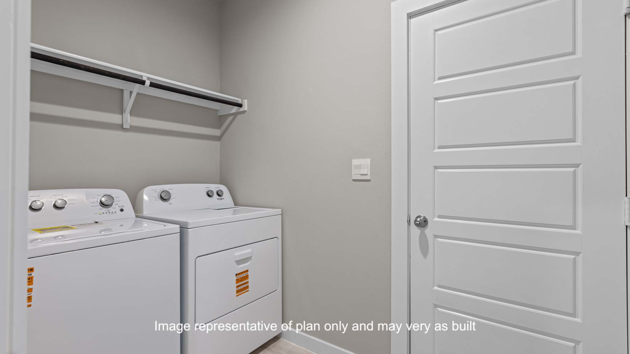 utility closet for washer and dryer hookups, extra storage space shelf above.